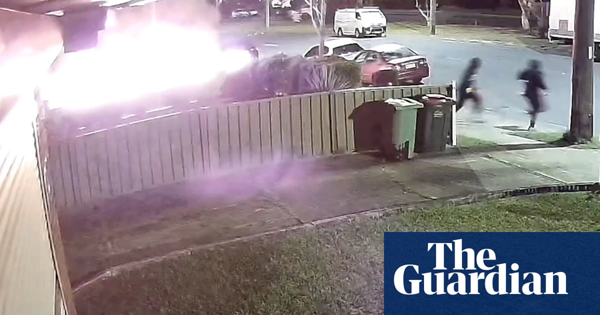 CCTV shows hooded men in alleged Sydney arson attack that left two with third-degree burns  video | Australia news