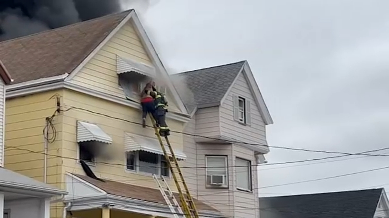 Bayonne house fire: Man rescued, over a dozen displaced after four-alarm blaze tears through NJ home [Video]