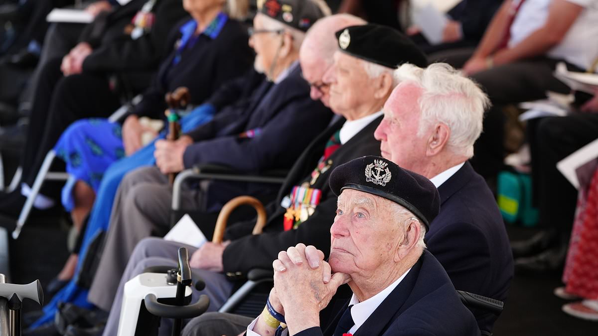 A minute’s silence for our fallen heroes: King and Queen lead silent prayer for D-Day soldiers who stormed beaches of Normandy before glorious Red Arrows flypast brings touching memorial service to an end [Video]